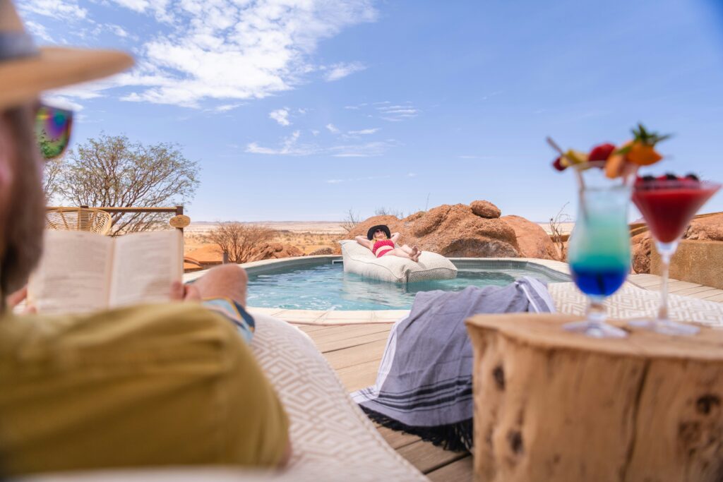 Couple enjoying the pool at The Saguaro