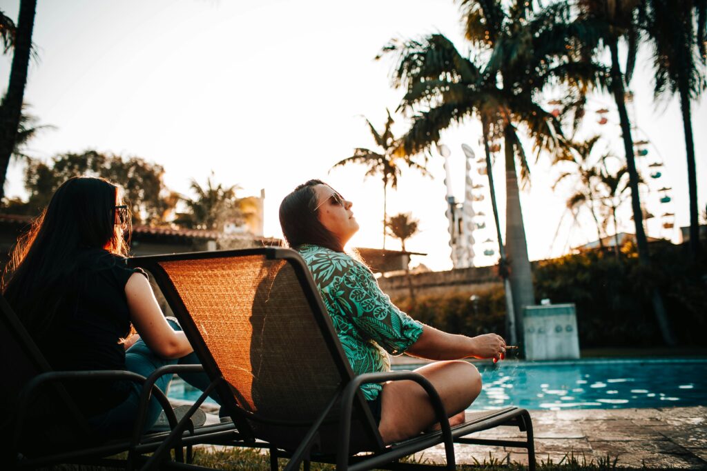 Couple relaxing by the pool in Palm Springs